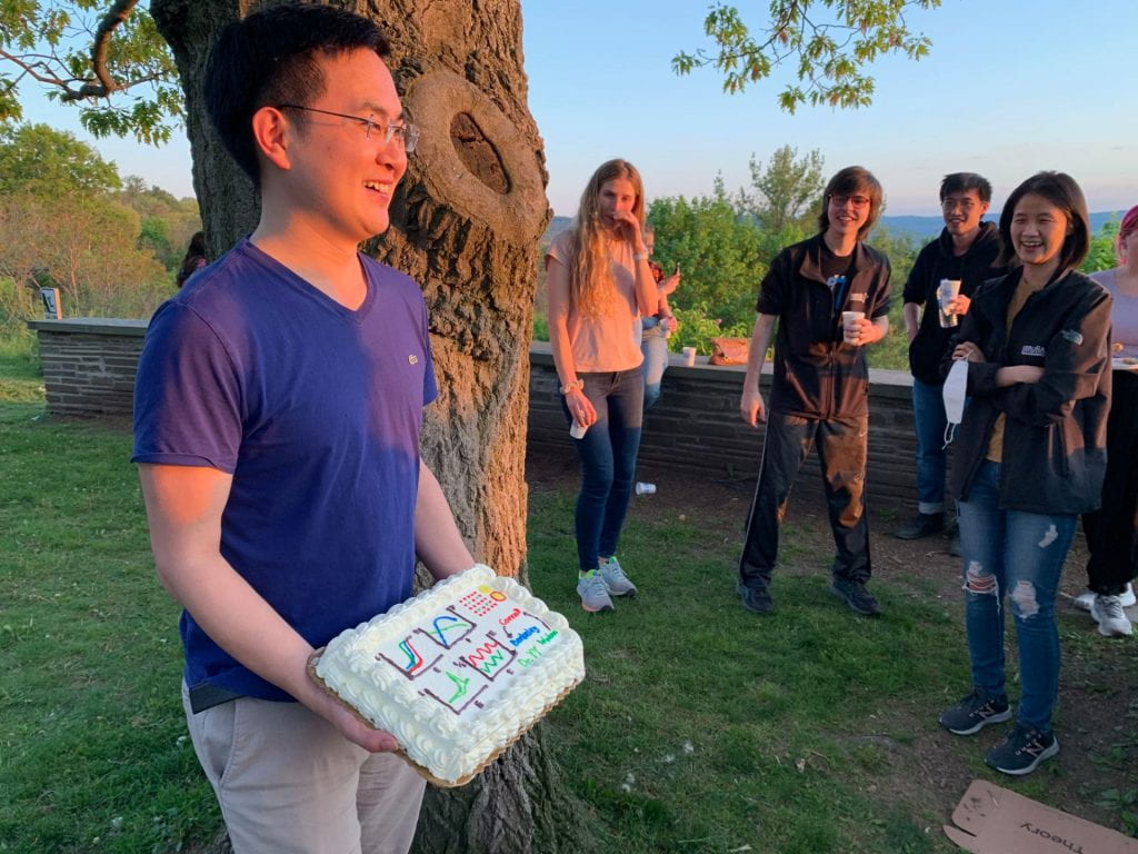 Yao holding a cake